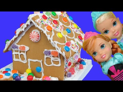 Gingerbread house BUILDING ! ELSA, ANNA toddlers use icing and candy