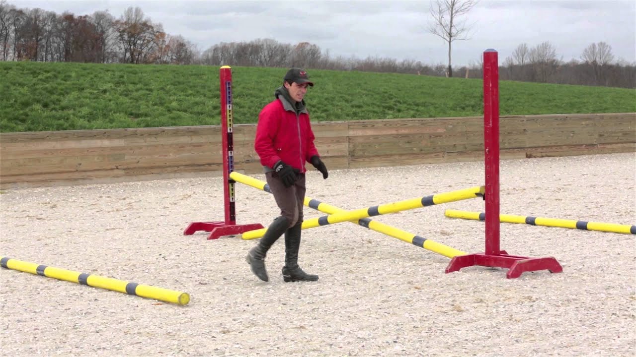 How to school a horse that rushes at jumps