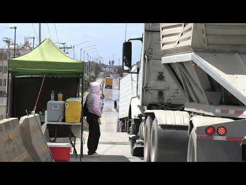 Trucks cross Mexico-US border as Trump announces country-specific reciprocal tariffs | AFP