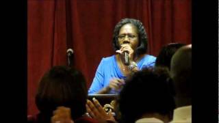 Pastor Eartha Edwards praying against the spirit of division