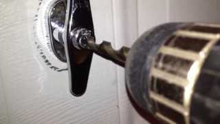 How to drill out a garage door handle lock