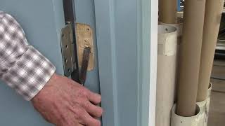 Adjusting a door with two pennies