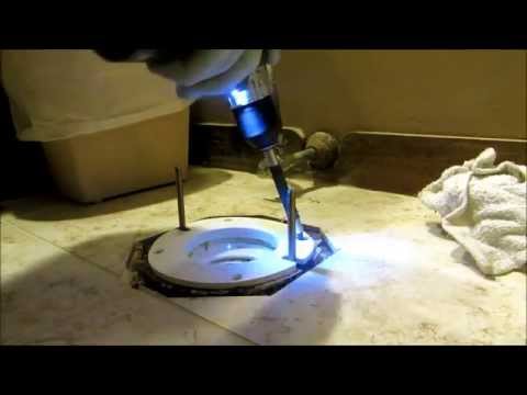 toilet flange raised above new tile floor