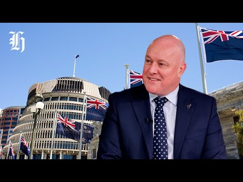 Prime Minister Christopher Luxon reacts after being challenged for leadership