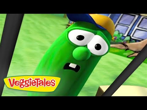 Green VeggieTales character with big eyes and surprised mouth, wearing a yellow-blue cap in a park-like background with the VeggieTales logo prominent on the left.
