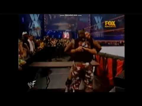 Kurt Angle suplexes Devon Dudley through table