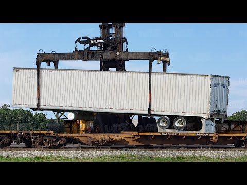 The Hypnotic Loading Process of Massive Train Wagon Flat Cars