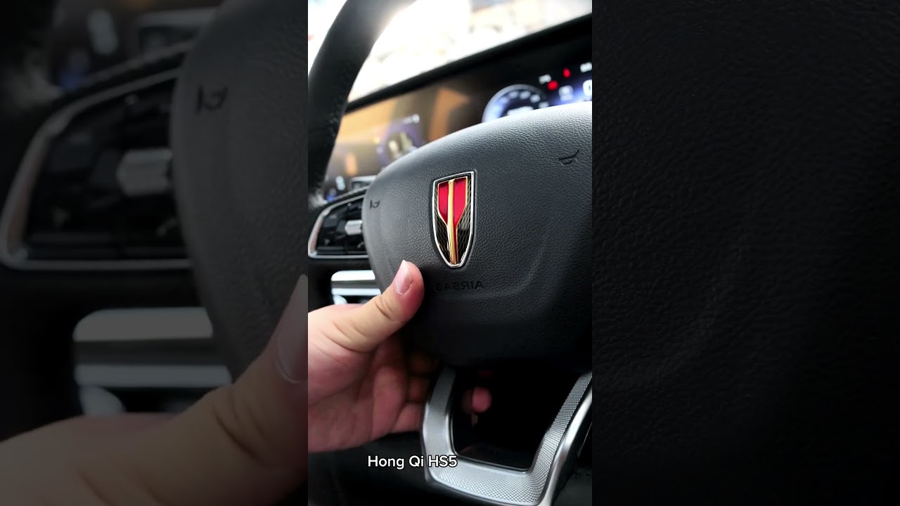 Car Show - Hong Qi HS5 made in China.  Car Logo is like a red arrow. Functional.