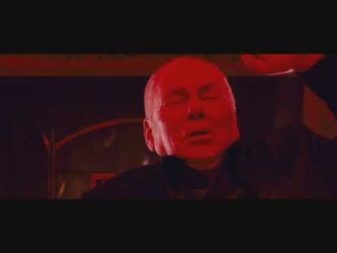 Punisher: War Zone trailer still with Ray Stevenson as Frank Castle silhouetted against neon