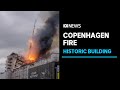 Copenhagen blaze collapses historic building's spire, prompts frantic rescue of artworks | ABC News