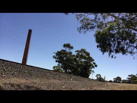9733V lead by GM22 , B61 and RL306 hauling grain through Stawell , January 18 2018 , camera 3