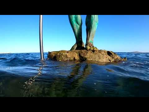 Neptuno, escultura de Luis Arenciba Betancort & Playa de Melenara, Telde, Gran Canaria.