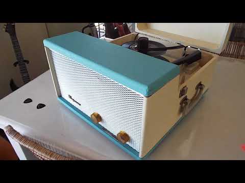 Magnavox portable record player playing few 45 RPM records.