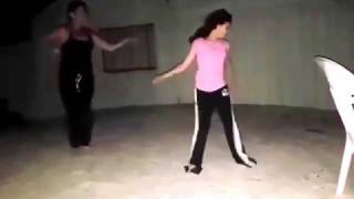 Mother and daughter beach dancing