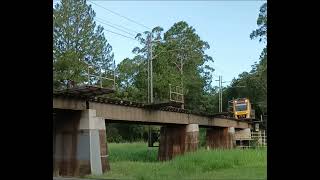 Queensland Rail's SMU 289 leads 265 working run 1L13 route BRNA into Eudlo station on Mon Feb 24.