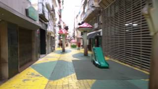Walking down calle san francisco in alicante with the street of mushrooms