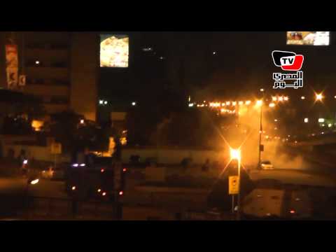 سقوط قنابل غاز على المارة أعلى كوبرى أكتوبر أثناء فض ميدان عبد المنعم رياض