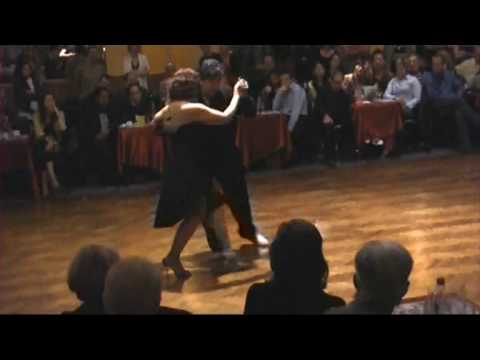  Corina de la Rosa  and  Julio Balmaceda  are  dancing  to  the  tango  "  Bailemos  "