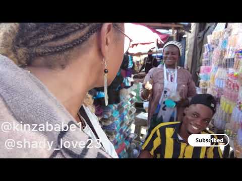 Shopping around at Kasoa market again, buying tools for farming