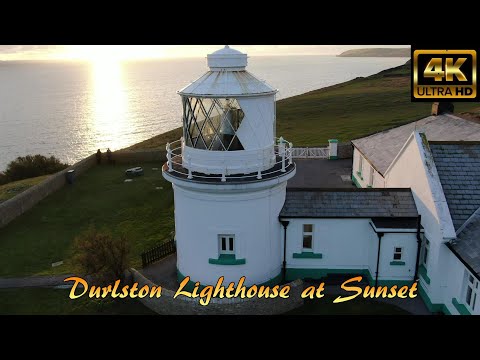 Durlston Lighthouse at Sunset, Swanage, Jurassic Coast, Dorset, UK by Drone - 4K