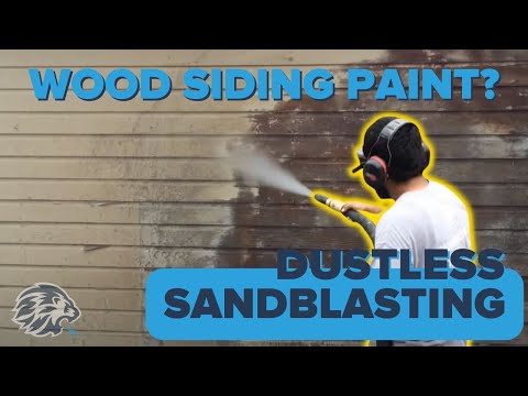 Dustless blasting to strip paint off a wood siding home