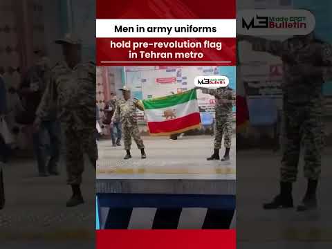 Men in Army Uniforms Carry Pre-Revolution Flag in Tehran Metro