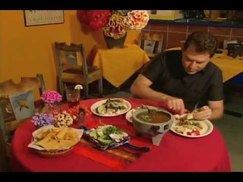 Bobby Flay enjoys some Mole tacos (Carne Asada,...