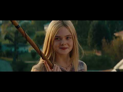 Super 8 trailer frame — the boys sprint through suburban streets at night