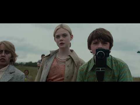 Super 8 official trailer still — the kids filming on Super 8 as a train thunders past