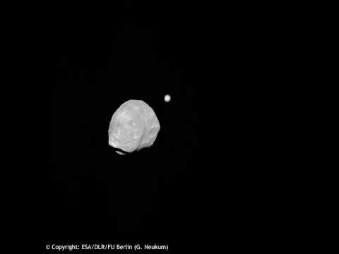 Phobos slips past Jupiter