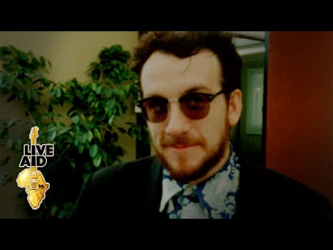 Thumbnail for Elvis Costello - Backstage Interview (Live Aid 1985) by Elvis Costello