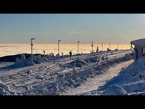 Video Thumbnail: Hikers enjoy early morning walk in snowy landscape in the Harz mountain range in northern Germany