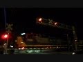 CSX Long Mixed Freight Train Through Town At Night