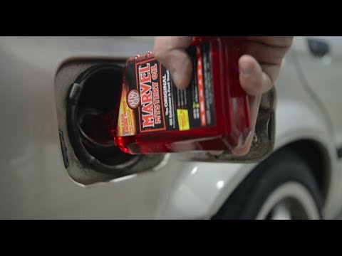 Adding Marvel Mystery Oil to Gas