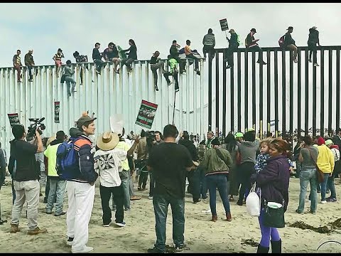 BREAKING NWO United Nations open borders Caravan MOB Invasion arrive @ USA Mexico border 11/15/18 Video