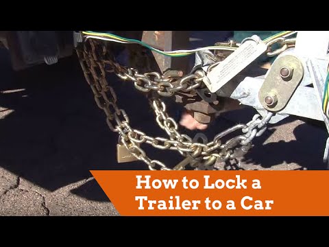 Part of a video titled How to Lock a U-Haul Trailer to the Tow Vehicle - YouTube
