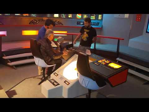 George Takei at the helm with James Cawley demoing the helm scope.