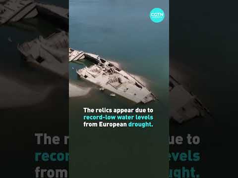 Sunken warships emerge from drought-stricken river