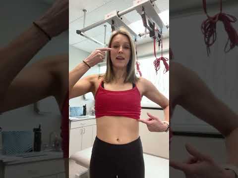 Demonstrating the Hypopressive "abdominal vacuum" technique used in low pressure fitness exercises.