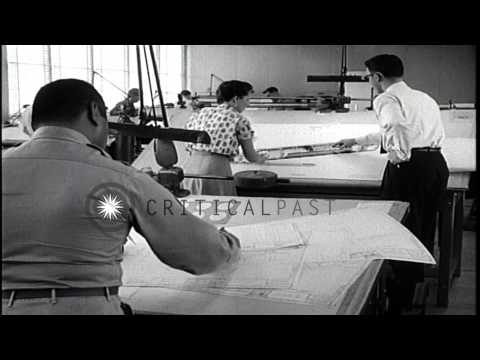 Draftsmen conferring over tables at the Redstone Arsenal office  in Huntsville, A...HD Stock Footage