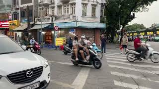 Crossing the street Hanoi Vietnam