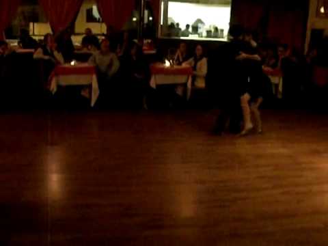  Kleber Queiroz  and  Juliana Maggioli  are  dancing  to  the  tango  "  Charamusca  "