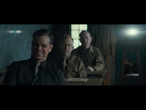 The Monuments Men trailer frame with Clooney, Damon and the squad walking through a war-torn European square