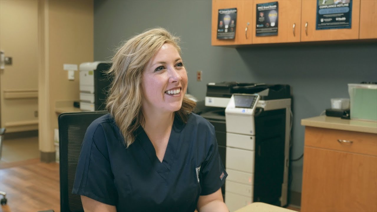 Woman in office smiles