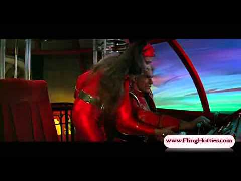 Ornella Muti (Flash Gordon) kisses Flash & sits on his lap in shiny red spandex - 720p