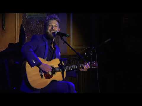 Benjamin Scheuer performs his song "See My Heroes" at the Eighth Annual Harvard-Yale Cantata