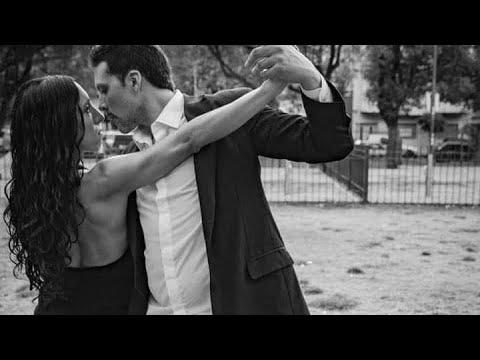  Albano Goldenberg  and  Angeles Verón  are  dancing  to  the  tango  "  Antiguo reloj de cobre  "  by  Osvaldo Pugliese