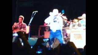 Charlie Daniels playing the fiddle