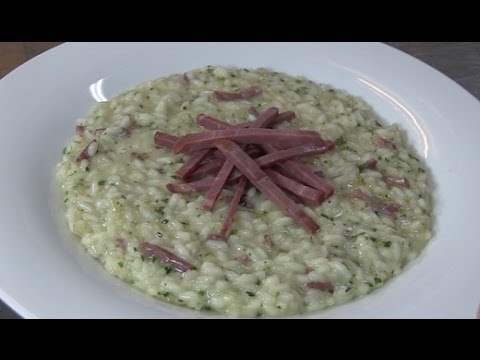 Risotto con prosciutto d'anatra, erbe aromatiche e stravecchio
