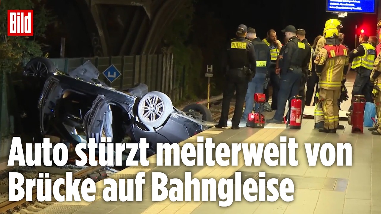 BERLIN: Raserunfall oder Straßenrennen? Auto stürzt metertief auf Gleise